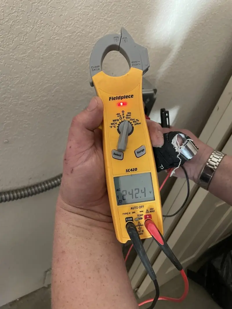 Voltage testing with clamp meter during Recessed Lighting Installation in Edgewater